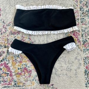 Zaful black strapless bikini set with white ruffles.